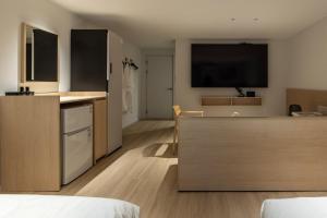 a kitchen and living room with a counter top at Anook Hotel Jungangro Station in Daejeon