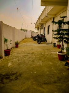 a group of motorcycles parked next to a building at Hotel GK Lodging & Boarding in Khāpri