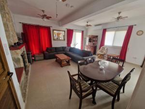 a living room with a table and a couch at Marmario Villa 10 in Anarita