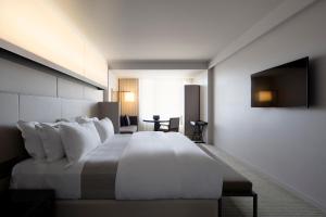 Postel nebo postele na pokoji v ubytování Hotel Realm