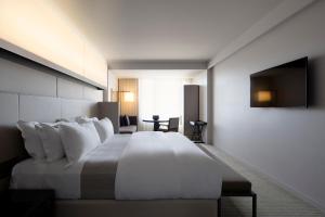 Ένα ή περισσότερα κρεβάτια σε δωμάτιο στο Hotel Realm