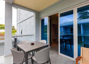 a dining room with a table and chairs at Cote d'Or Retreat in Anse Volbert Village