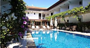 a swimming pool in front of a house at So Dalyan in Ortaca