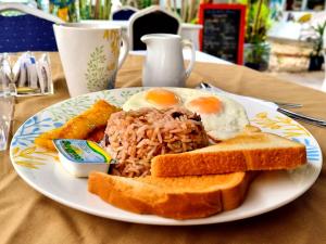 a plate of breakfast food with eggs and toast at Hotel 1492 in San José