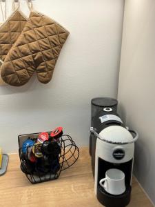 a coffee maker sitting on top of a table at EPICENTAR Luxury Jacuzzi & Sauna Apartment in Baščaršija - Private Spa Experience in Sarajevo