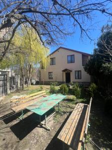 a ping pong table in front of a house at Mtskheta View Hotel in Mtskheta