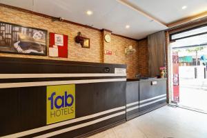 a fast food restaurant with a sign on the counter at FabHotel Step Inn Stays in Ballygunge