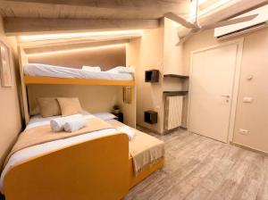 a bedroom with two bunk beds in a room at Iseo Lake Luxury Duplex - Centro & Design in Iseo