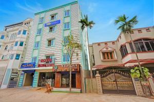 a dog is standing in front of a building at FabHotel Ultra Stay in Bhubaneshwar
