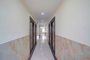 a corridor of a building with doors at FabHotel Ultra Stay in Bhubaneshwar