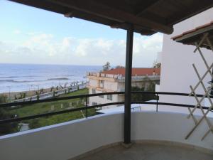 a balcony with a view of the ocean at STUDIO WITH SEA VIEW - KYPARISSIA beach in Kyparissia