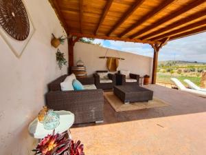 a living room with a couch and a table at Finca Guillermo Murcia in Cañada del Trigo