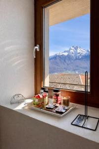 a tray of food sitting on a window sill at Rustico Maria Full House Lake View Escape in Vercana +25 photos