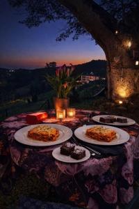 a table with three plates of food on it at Gallo Vista B & B in Gillitts-Emberton