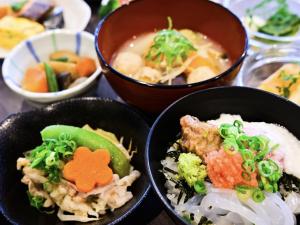 a group of bowls of food on a table at Dormy Inn Hakata Gion in Fukuoka