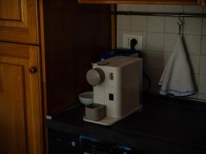 a coffee maker on a counter in a kitchen at L'Introvabile Luxury Suite Cesena in Cesena +23 photos