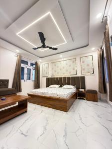 a bedroom with a bed and a ceiling at SanjayHomestay in Rāmpur
