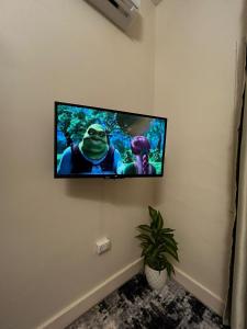 a flat screen tv hanging on a wall at Terra Pyramids Hotel in Cairo