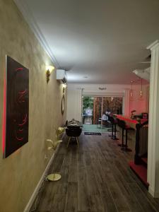 a living room with a table and a piano at Shiny Cloud Love Room in Limoux