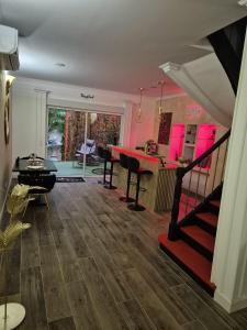 a living room with a staircase and a dining room at Shiny Cloud Love Room in Limoux