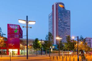 a city at night with tall buildings and street lights at Altitude 24 Panorama and Spa in Mulhouse
