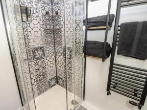 a shower with a glass door in a bathroom at 2 Low Road in Bishop Auckland +35 photos