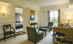 a living room with a couch and a table at Villa Rosa Kempinski in Nairobi