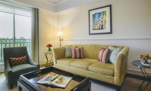a living room with a couch and a chair at Villa Rosa Kempinski in Nairobi
