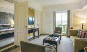 a living room with a couch and a table and a bed at Villa Rosa Kempinski in Nairobi +158 photos