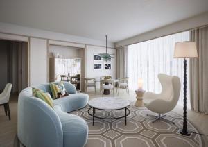 a living room with a couch and a table at The River Lee Hotel a member of The Doyle Collection in Cork