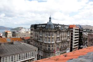 an old building with a tower on top of it at InsideHome Porta do Sol in Vigo