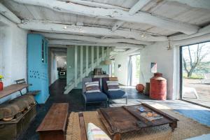 a living room with a couch and a table at Casa de Cabanelas in Bustelo +64 photos