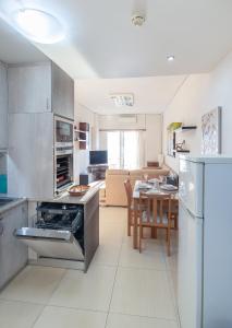 a kitchen with an oven and a dining room at Seaside Apartment with a great view in Chalkida in Chalkida