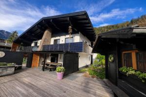 a house with a solar array on the deck at Landhaus Osttirol in Iselsberg