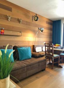 a living room with a couch and a table at Landhaus Osttirol in Iselsberg