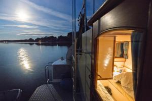 a view of the back of a boat on the water at Budget Apartments at Niderviller Marina by Kuhnle-Tours in Niderviller