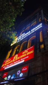 a building with neon signs on the side of it at HoTEL SRI DURGA GRAND in Vijayawāda