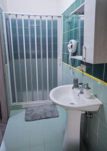 a bathroom with a sink and a shower at B&B dalla Nonna in Salerno