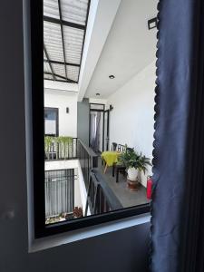 a view of a balcony from a house at La Me Villa Hoi An in Hoi An