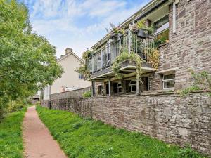 a brick wall with a balcony on a building at 2 Bed in Brecon oc-bn140 in Brecon