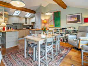 a kitchen and living room with a table and chairs at 2 Bed in Brecon oc-bn140 in Brecon