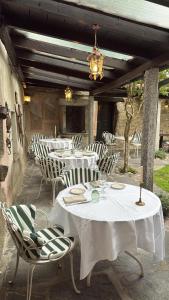 a group of tables and chairs on a patio at Locanda Motto del Gallo in Taverne