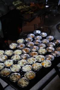a bunch of cupcakes sitting on top of a stove at Sunset Garden in Phúc Trì