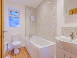 a white bathroom with a toilet and a sink at 2 Bed in Bridgnorth oc-77721 in Highley +18 photos