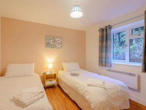 a bedroom with two beds and a window at 2 Bed in Bridgnorth oc-77721 in Highley