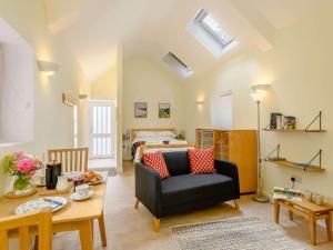 a living room with a couch and a bed at 1 Bed in Clyro oc-86975 in Clyro