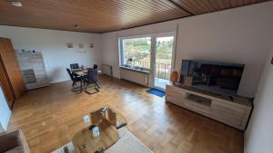 an overhead view of a living room with a television at Ferienhaus Kusel Blick in Kusel