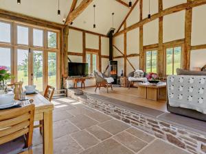 a living room with wooden ceilings and windows at 2 Bed in Abergavenny oc-66630 in Dorstone