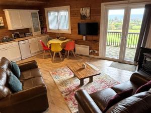 a living room with a couch and a table at 3 Bed in Hereford oc-bn141 in Clyro +24 photos