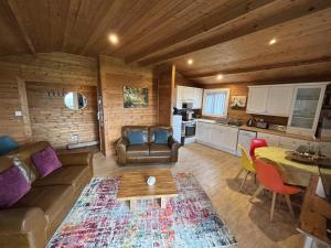 a living room with a couch and a table at 3 Bed in Hereford oc-bn141 in Clyro